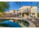 Expansive backyard view featuring a refreshing swimming pool, perfect for enjoying sunny days and outdoor gatherings at 1550 S Chaparral Blvd, Gilbert, AZ 85296