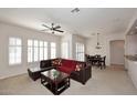 Bright living room with a ceiling fan, comfortable seating, and natural light at 16420 N Thompson Peak Pkwy # 2020, Scottsdale, AZ 85260
