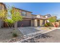 Attractive two-story home featuring a two-car garage and meticulously maintained xeriscape front yard at 17736 W Cassia Way, Goodyear, AZ 85338