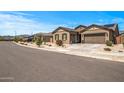 Street view of a well-maintained home with desert landscaping, a two-car garage, and a neighborhood setting at 18970 W Desert Hills Dr, Surprise, AZ 85388
