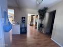 Spacious living room with wood-look floors, flowing layout, and potential for various furniture arrangements at 2729 W Keim Dr, Phoenix, AZ 85017