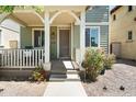 Inviting front porch with seating area, neutral accents, and charming curb appeal at 2941 N Evergreen St, Buckeye, AZ 85396