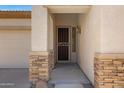 The entry features stone accents and a decorative security screen door at 3531 N Sericin --, Mesa, AZ 85215