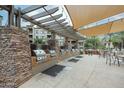 An outdoor grill area featuring stone accents, stainless steel grills, and shaded seating at 5450 E Deer Valley Dr # 1201, Phoenix, AZ 85054