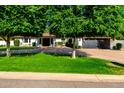 Charming single-story home with manicured lawn and mature trees at 8031 N 12Th Ave, Phoenix, AZ 85021