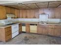 Traditional kitchen featuring wood cabinets, an oven range, and tiled ceiling at 9846 N 10Th St, Phoenix, AZ 85020
