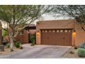 Charming home featuring a spacious three-car garage with appealing curb appeal and desert landscaping at 13450 E Via Linda St # 1019, Scottsdale, AZ 85259