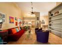 Bright living room with high ceilings, tile floors, and an open layout at 1221 E Cholla St, Phoenix, AZ 85020