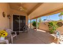 Relaxing covered patio with seating area, perfect for outdoor enjoyment at 13731 W Countryside Dr, Sun City West, AZ 85375