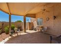 Spacious covered patio with ceiling fan, seating, and outdoor area at 13731 W Countryside Dr, Sun City West, AZ 85375