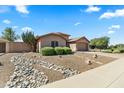 Landscaped front yard with drought-resistant landscaping and decorative rock stream at 2453 E Nathan Way, Chandler, AZ 85225