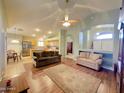 Open floor plan featuring living room, kitchen, and dining area perfect for entertaining and Gathering gatherings at 2453 E Nathan Way, Chandler, AZ 85225