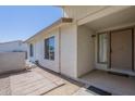 Inviting front porch with a neutral color scheme, textured walls, and a convenient mat at 4621 E Mineral Rd, Phoenix, AZ 85044