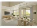 Bright living space with dining area, comfortable seating, and sliding doors to outdoor space with natural light at 20100 N 78Th Pl # 2105, Scottsdale, AZ 85255