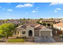 Charming single-story home with a well-manicured lawn and a two-car garage in a peaceful neighborhood at 3574 E Tonto Pl, Chandler, AZ 85249