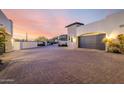 Desert home with a long driveway leading to a private entrance and garage at 36075 N Summit Dr, Cave Creek, AZ 85331