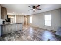 Living room featuring vinyl floors and abundant natural light at 10951 N 91St Ave # 6, Peoria, AZ 85345