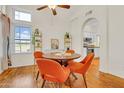 Bright dining room area with wood floors, modern light fixture, and plenty of natural light at 155 W Knox Rd, Tempe, AZ 85284