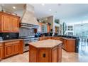 Gourmet kitchen featuring custom cabinets, granite countertops, and professional-grade Viking appliances at 16441 S Mountain Stone Trl, Phoenix, AZ 85048