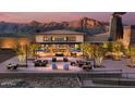 Inviting outdoor area with comfortable seating, ambient lighting, and beautiful mountain views at 20847 W Montebello Ave, Buckeye, AZ 85396
