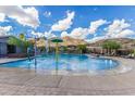 Stunning community pool featuring splash pad and mountain views offers residents resort-style living at 21412 W Hubbell St, Buckeye, AZ 85396