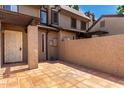 Private outdoor patio space features beautiful tiled flooring and stucco privacy wall at 2232 W Lindner Ave # 20, Mesa, AZ 85202