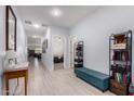 Spacious hallway with tile flooring, a small desk and ample space for decor at 2458 N Abbey Rd, Casa Grande, AZ 85122