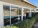 Wall of sliding glass doors overlooking the pool and backyard, allowing for natural light and views at 2544 E Elm St, Phoenix, AZ 85016