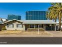 Charming single-story home featuring a covered carport and well-maintained front yard landscaping at 2544 E Elm St, Phoenix, AZ 85016
