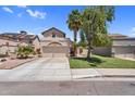 Beige two-story home boasting a spacious driveway, manicured lawn, a two-car garage, and beautiful palm trees at 3608 W Harrison St, Chandler, AZ 85226