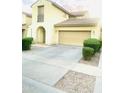 Charming two-story home with a two-car garage and landscaped yard with shrubbery at 7136 N 73Rd Dr, Glendale, AZ 85303