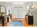 Bright foyer with hardwood floors, stylish decor, and double-door entry at 8046 W Yukon Dr, Peoria, AZ 85382