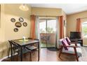 Cozy dining area with seating for four and access to the outdoor patio area at 10030 W Indian School Rd # 221, Phoenix, AZ 85037