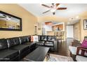 Relaxing living room with open concept to kitchen and comfortable modern furniture at 10030 W Indian School Rd # 221, Phoenix, AZ 85037