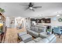 Spacious living room featuring tile floors, a comfortable seating area, and an open layout to the kitchen at 12690 S 184Th Ave, Goodyear, AZ 85338
