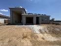 New construction home with a stucco exterior and attached two-car garage at 15785 W Cheryl Dr, Waddell, AZ 85355