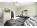 Cozy main bedroom with TV, ceiling fan, and a closet with ample storage space at 16246 W Talara Way, Surprise, AZ 85374