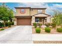 Charming two-story home with a well-manicured front yard and a two-car garage, perfect for suburban living at 17424 W Willow Ave, Surprise, AZ 85388