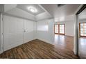 Bright entryway featuring wood-look flooring, double doors, and a glimpse into the adjoining living space at 18811 N 19Th Ave # 2020, Phoenix, AZ 85027