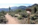 Picturesque hiking trail through the desert with mountain views and signage, perfect for outdoor enthusiasts at 19988 W Marshall Ave, Litchfield Park, AZ 85340