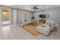 Spacious living room features tile flooring, a ceiling fan, and sliding glass doors leading to the backyard at 3603 E Salter Dr, Phoenix, AZ 85050