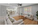 Bright and airy living room with an open floor plan, seamlessly connecting to the kitchen and backyard at 3603 E Salter Dr, Phoenix, AZ 85050