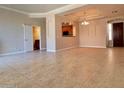 Spacious living area featuring neutral tile flooring and decorative tray ceiling at 3820 E Mcdowell Rd # 102, Phoenix, AZ 85008