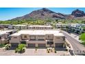Modern home exterior elevation featuring neutral tones, clean lines, and convenient two-car garages at 5533 E Stella Ln, Paradise Valley, AZ 85253