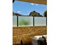 Scenic view from the patio featuring frosted glass privacy and mountain views at 5533 E Stella Ln, Paradise Valley, AZ 85253