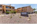 View of the Woodland Springs Condominiums complex with desert landscaping at 8055 E Thomas Rd # B208, Scottsdale, AZ 85251