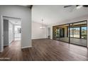 Open living room with a sliding glass door leading to the backyard at 8443 E Via De Los Libros --, Scottsdale, AZ 85258