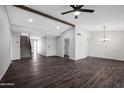Spacious living room featuring light walls, wood floors, and neutral fixtures at 8443 E Via De Los Libros --, Scottsdale, AZ 85258