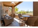 Relaxing outdoor balcony with seating, offering views of the desert landscape at 8880 E Paraiso Dr # 118, Scottsdale, AZ 85255