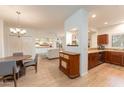 Spacious open-concept living area with kitchen, dining, and living room, perfect for entertaining at 8880 E Paraiso Dr # 118, Scottsdale, AZ 85255